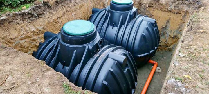 Two plastic underground storage tanks placed below ground for harvesting a rainwater.